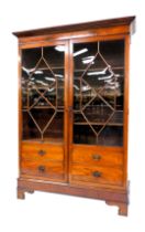 A George III mahogany display cabinet, the outswept pediment over a pair of astragal glazed doors, w