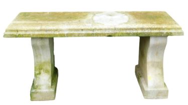 A concrete garden bench, the rectangular top raised on curved supports, 100cm wide.