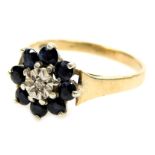A 9ct gold sapphire and diamond flower head ring, in a claw setting, size O, 2.9g.