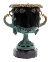 A Continental black pottery and metal urn, of twin handled form, overlaid with vines, with partial v