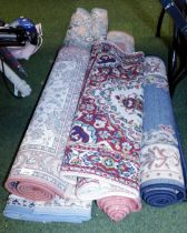 Five machine made rugs, of various design.