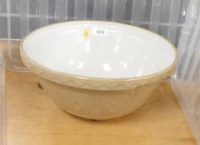 A large brown and white baking bowl.