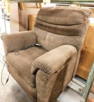 A reclining brown upholstered armchair, with dual motors. Buyer Note: WARNING! This lot contains unt