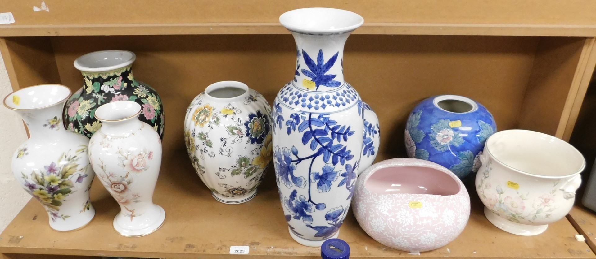 A quantity of Oriental ceramic vases, including a large blue and white vase, various other vases, mo