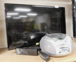 A Polaroid flat screen television, model number P24D300FP, with remote control, and a Roberts compac