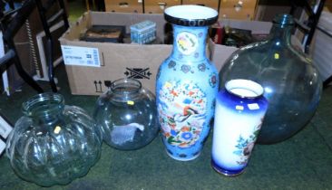 An Oriental style floor standing vase, decorated with reserves of birds against a blue ground, 65cm