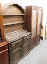 A 20thC oak Welsh type dresser, the arched top above three shelves, the base with two drawers above