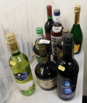 Eight bottles of alcohol, including Gaston le Grange Selection cognac, Martini, Grant's Morello Cher