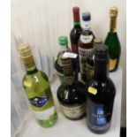 Eight bottles of alcohol, including Gaston le Grange Selection cognac, Martini, Grant's Morello Cher