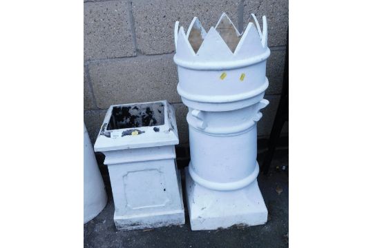 A painted composition chimney pot, of turreted type form, 84cm high, and another, 54cm high.