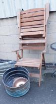 Two teak folding garden chairs, together with a copper cylindrical vessel, and another.