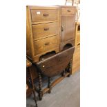 A 20thC elm and oak drop leaf gate leg table, oak three drawer bedside cabinet, etc. (3)