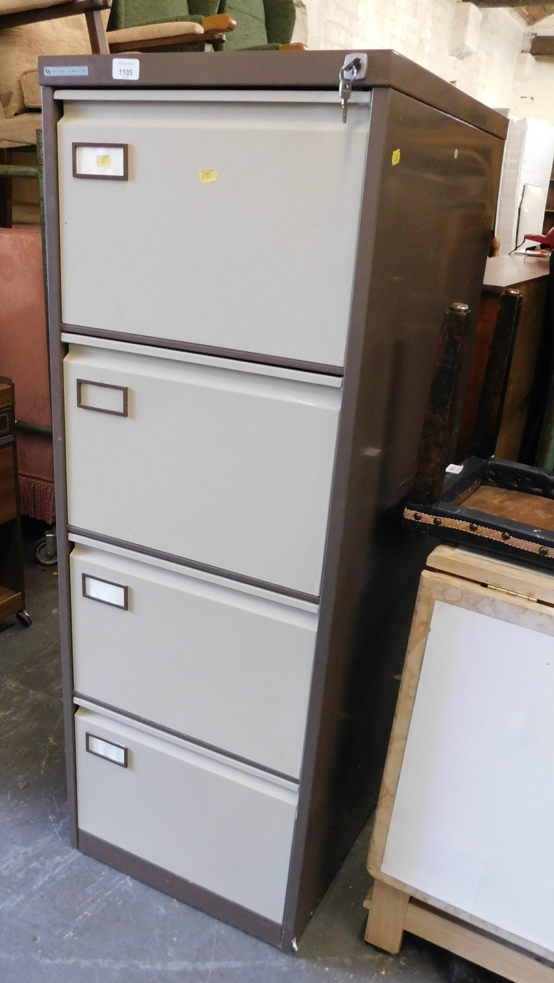 A Vicker's Furniture four drawer metal filing cabinet, 134cm high, 48cm wide, 66cm deep.