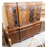 A 20thC Regency style mahogany breakfront display cabinet, the top with a moulded edge with dentil m