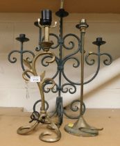 Three wrought metal table lamps.