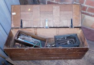 A pine tool chest, containing various hand tools, leather tape measure, wooden block plane, etc.