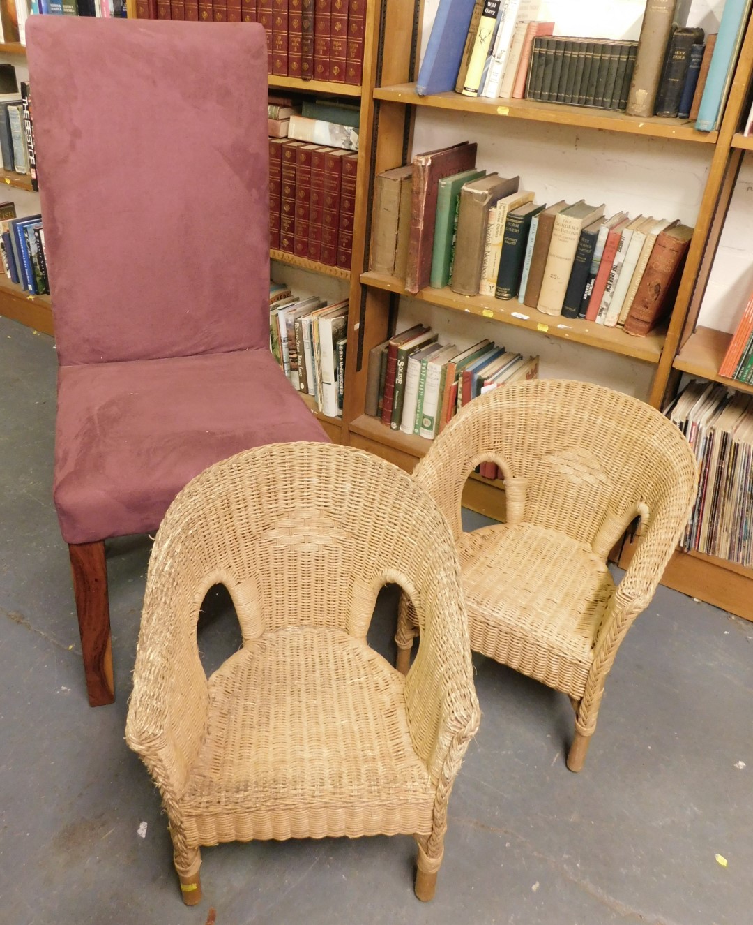 A pair of child's wicker tub chairs, and a high back dining chair upholstered in aubergine suede typ