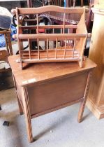 A mahogany sewing box, together with a mahogany magazine rack.