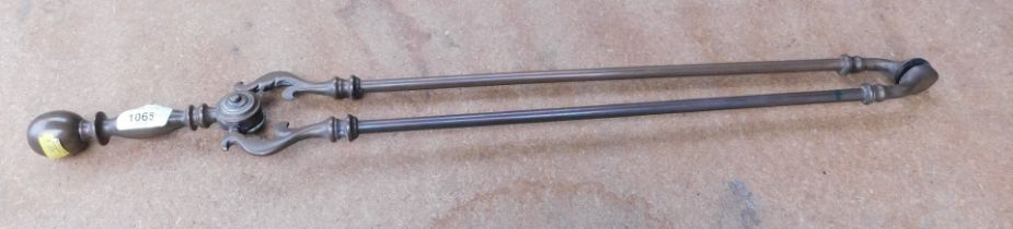 A pair of Victorian fire tongs.