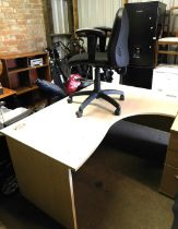 A modern lightwood office desk, 73cm high, the top 162cm x 104cm, together with an office chair.