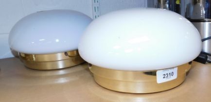 A pair of opalescent glass and brass domed light shades, 26cm diameter.