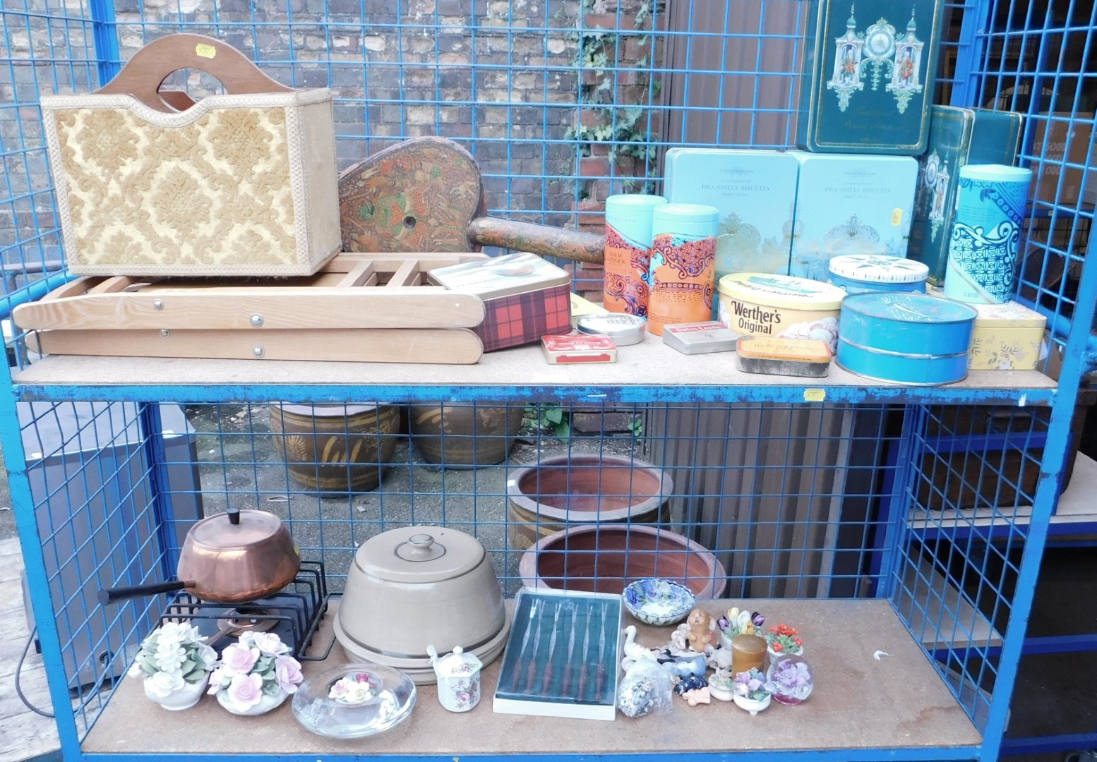 Various bygone tins, together with a magazine rack, folding chair, ceramics, glassware, etc. (2 shel