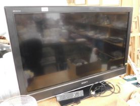 A Sony Bravia flat screen television, model number KDL-40D3500, with remote.