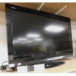 A Toshiba flat screen television, model number 32AV615DB, with remote control.