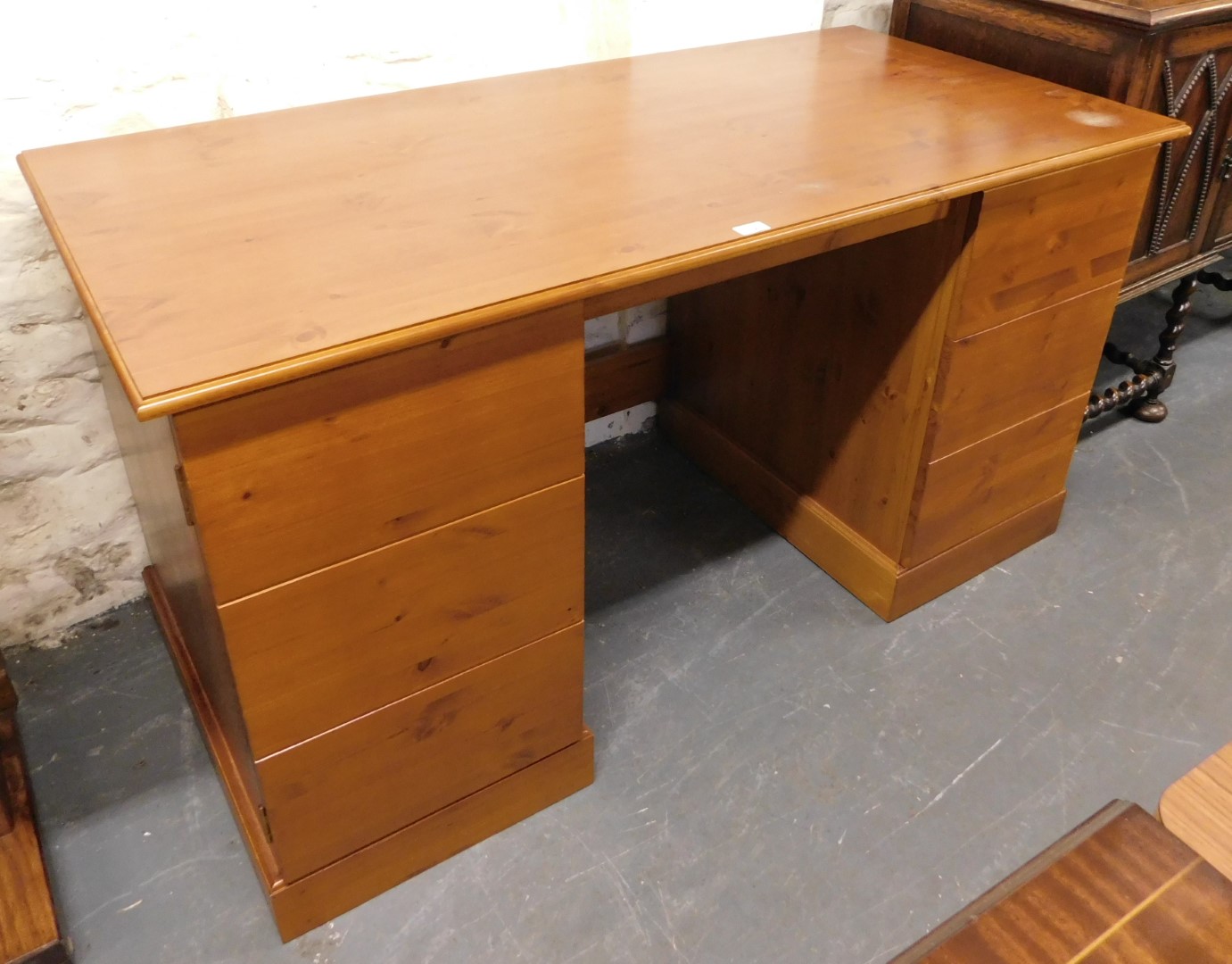 A twin pedestal desk, 80cm high, 146cm wide, 71cm deep.