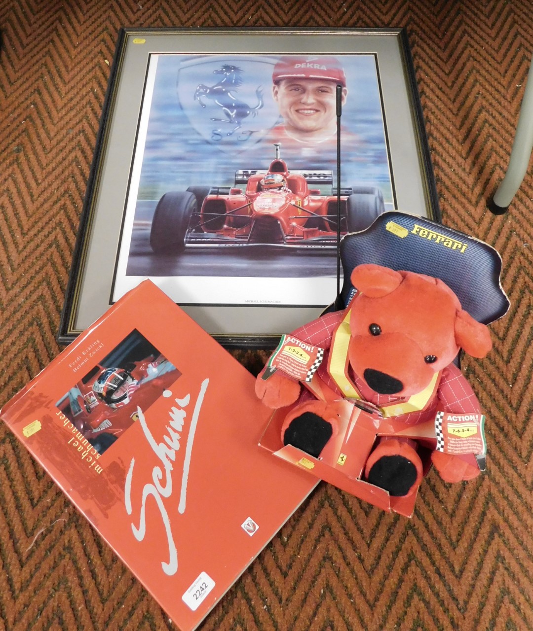 Michael Schumacher memorabilia, including a large framed and glazed portrait of Michael with car, a