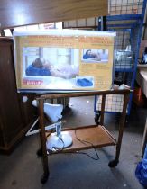 A mid century two tier trolley, together with a viscose elastic headrest, and an Anglepoise type lam