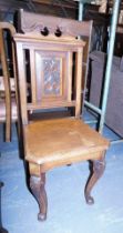 A 19thC mahogany hall chair, the top with carved swan neck pediment, with a scroll carved fielded pa