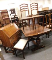 A group of furniture, to include an oak draw leaf dining table, a pair of mahogany and inlaid bedroo