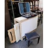 A beech and melamine drop leaf kitchen table, together with a briefcase and stool. (3)