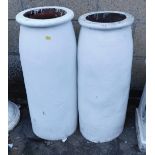 A pair of painted terracotta chimney pots, of cylindrical form, 77cm high.