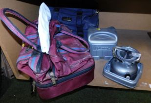 Two camping stoves, camping stove bag, and a bag containing bowls.