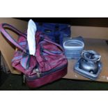 Two camping stoves, camping stove bag, and a bag containing bowls.
