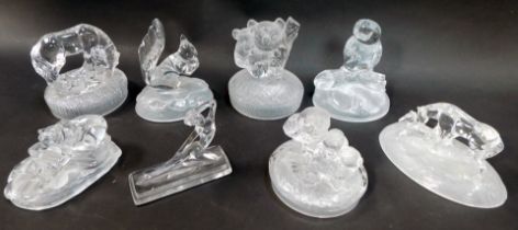 A group of moulded glass paperweights, to include owl on branch, 16cm high, squirrel holding nut, 14
