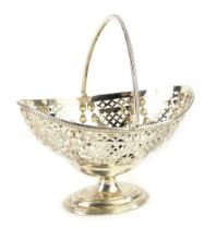 A George V silver sweetmeat basket, of oval footed form, with pierced decoration and embossed hare b