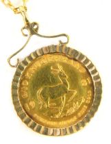 A one tenth of a Krugerrand gold coin pendant and chain, the coin dated 1981, in 9ct gold mount, on