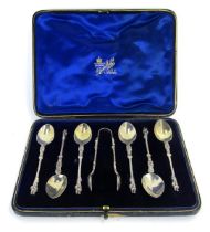 A set of six Victorian silver apostle coffee spoons, and a pair of sugar tongs, Richard Martin and