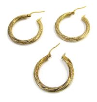 Three 9ct gold bi-colour hoop earrings, 2.5cm wide, 2.6g.