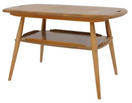 An Ercol light elm two tier butler's tray table, the rounded rectangular top with two handles, above