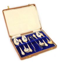 A cased set of mid century teaspoons and tongs, each with scroll and feathered top, import marks, st