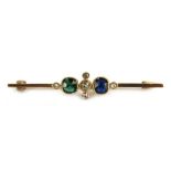 A stone set bar brooch, set with oval cut sapphire and emerald, and five old cut tiny diamonds
