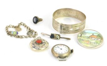 Silver and other jewellery, comprising a silver etched bangle, a white metal circular locket in Midd