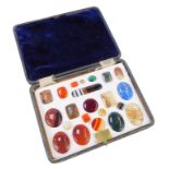 A cased set of semi precious stones, to include malachite, lapis lazuli, agate, and others, fitted i