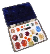 A cased set of semi precious stones, to include malachite, lapis lazuli, agate, and others, fitted i