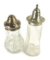 Two 20thC silver topped and cut glass sugar sifters, 14cm and 19cm high.