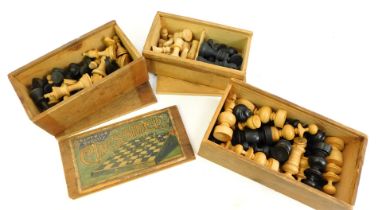 Three partial boxwood chess sets, in wooden cases.